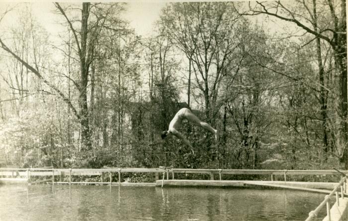 Student diving into Lake Eden