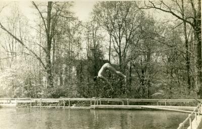 Student diving into Lake Eden