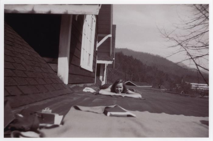 Student sunbathing on the roof of North Lodge