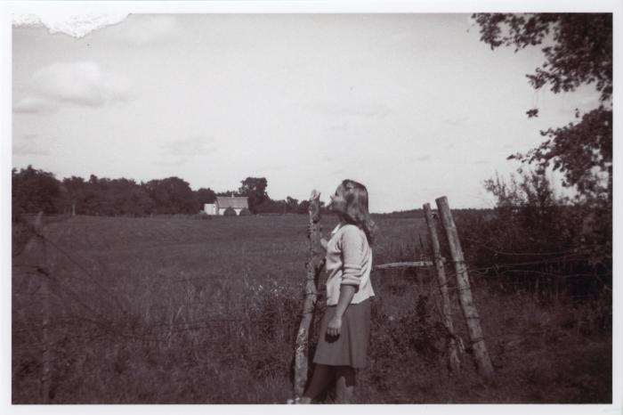 Verna Raattama Schauffler or Dorothy Raattama Bergman next to pasture