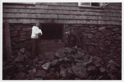 Verna Raattama Schauffler or Dorothy Raattama Bergman and unidentified student hauling coal at Lake Eden campus