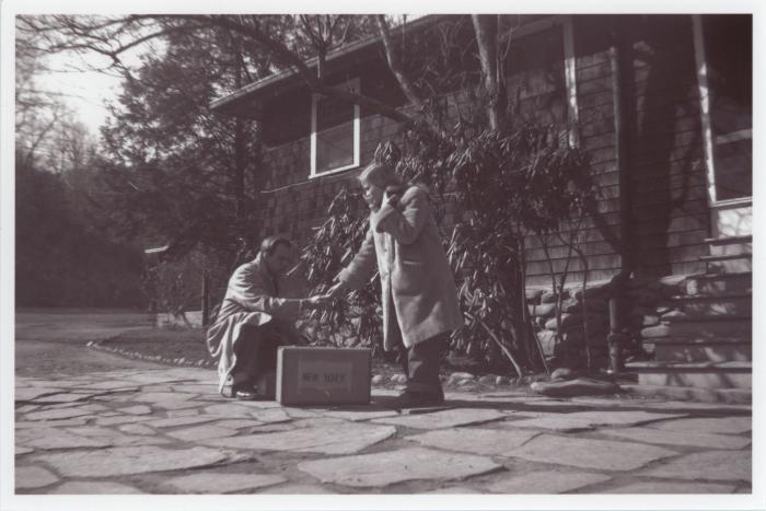 Henry Bergman and Dorothy Raattama Bergman with suitcase outside Dining Hall