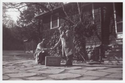 Henry Bergman and Dorothy Raattama Bergman with suitcase outside Dining Hall