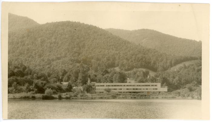 View of the Studies Building and farmland across Lake Eden