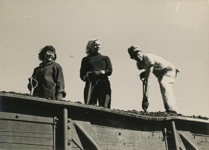 Vera Baker Williams, Nancy Miller Archer, and Gregory Masurovsky shoveling coal