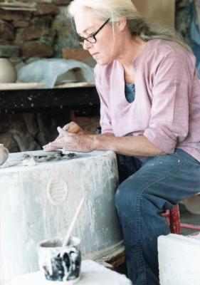 Cynthia Homire at the potter's wheel